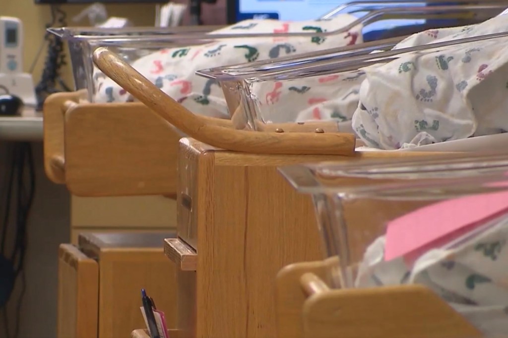 Infant bassinets in a hospital nursery.