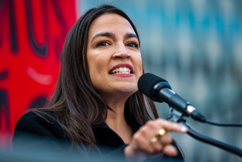 Alexandria Ocasio-Cortez speaking at a rally.