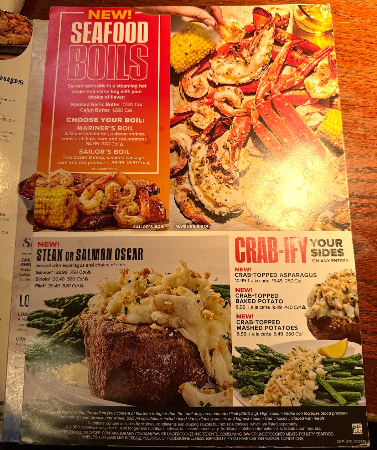 Red Lobster Crabfest menu showing seafood boils, steak or salmon Oscar, and the option to "crab-ify" your side dishes