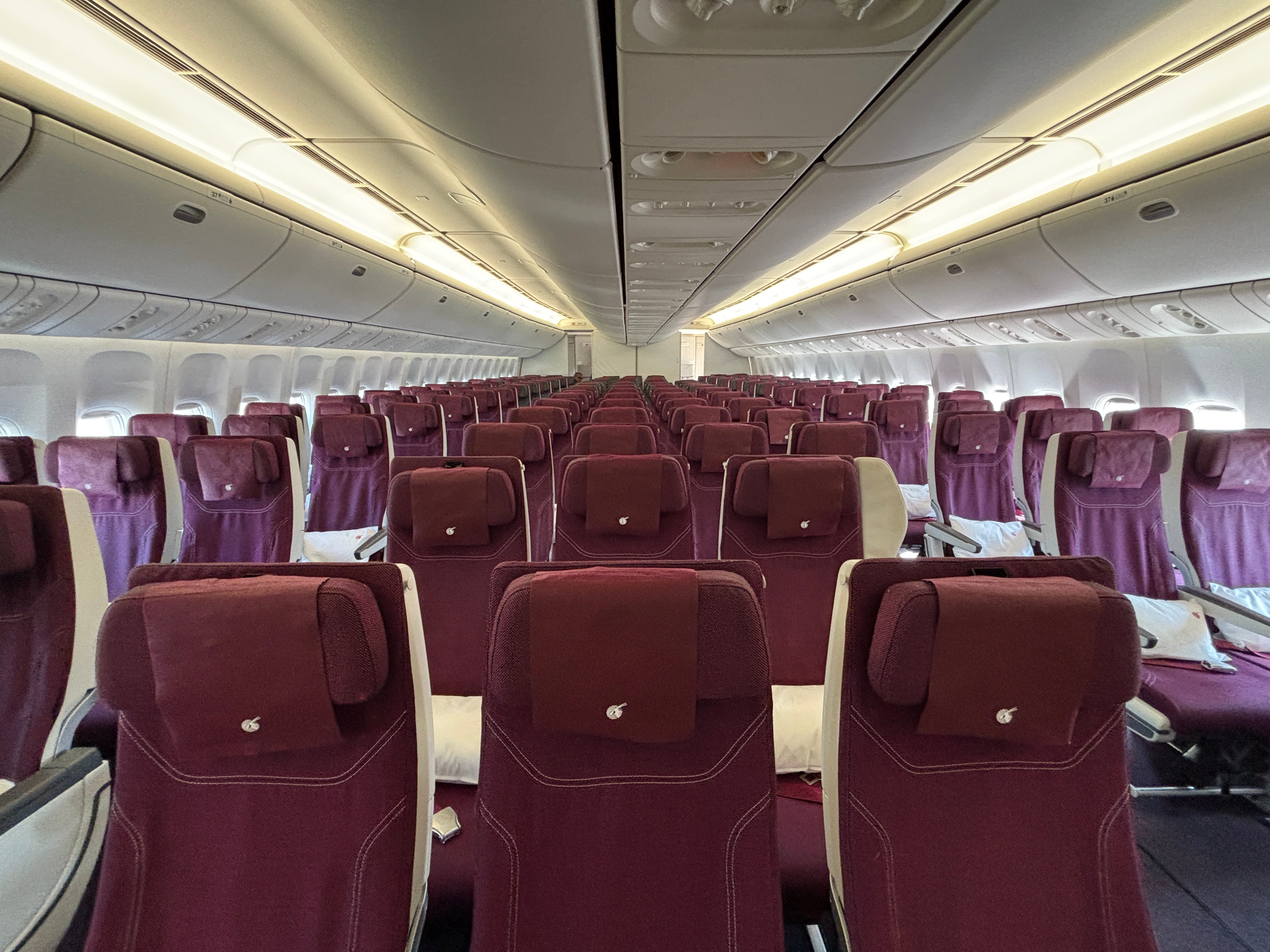 The economy cabin as seen from the front of a Qatar Airways Boeing 777