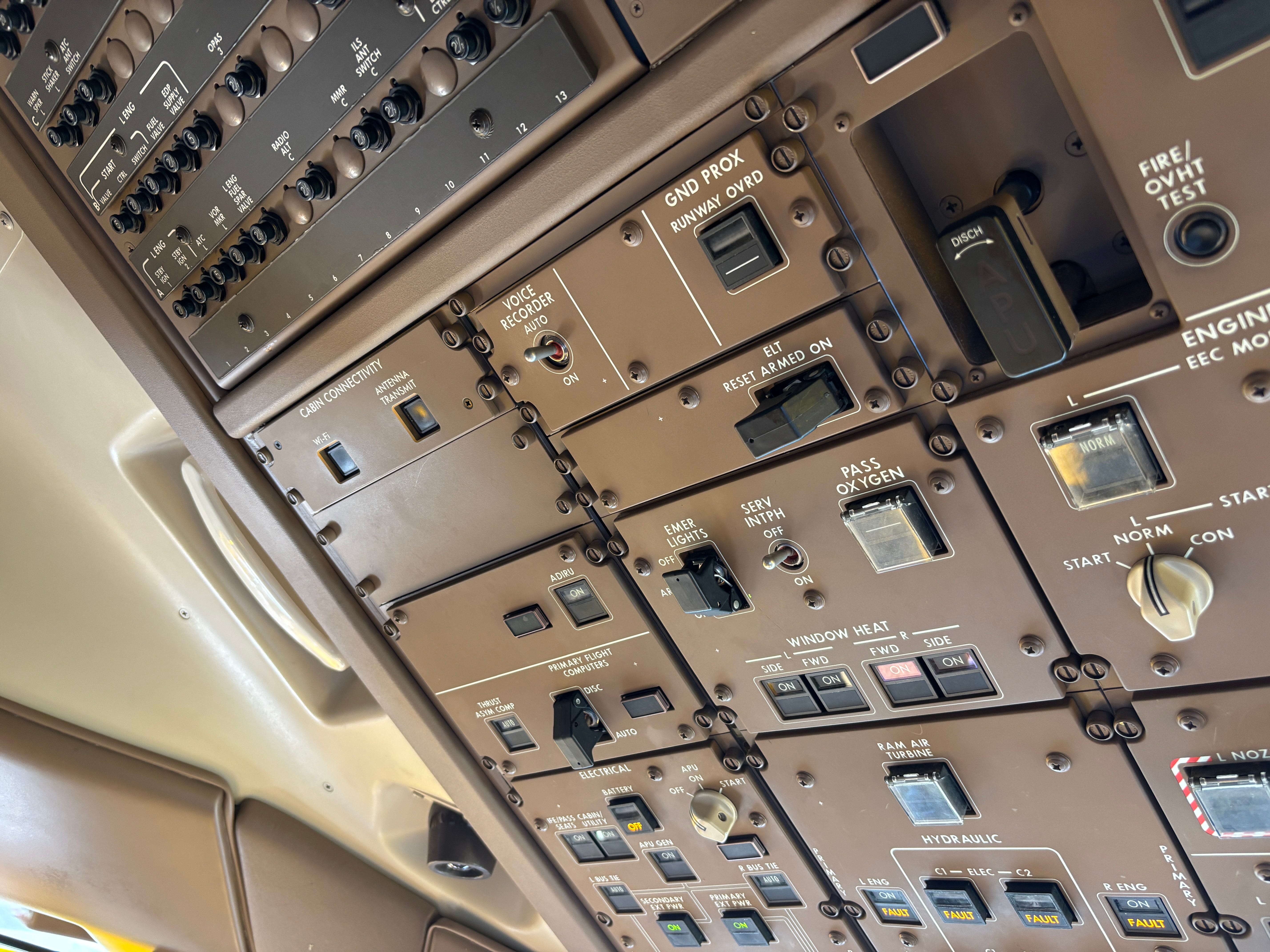 Switches on the dashboard in the cockpit of a Qatar Airways Boeing 777