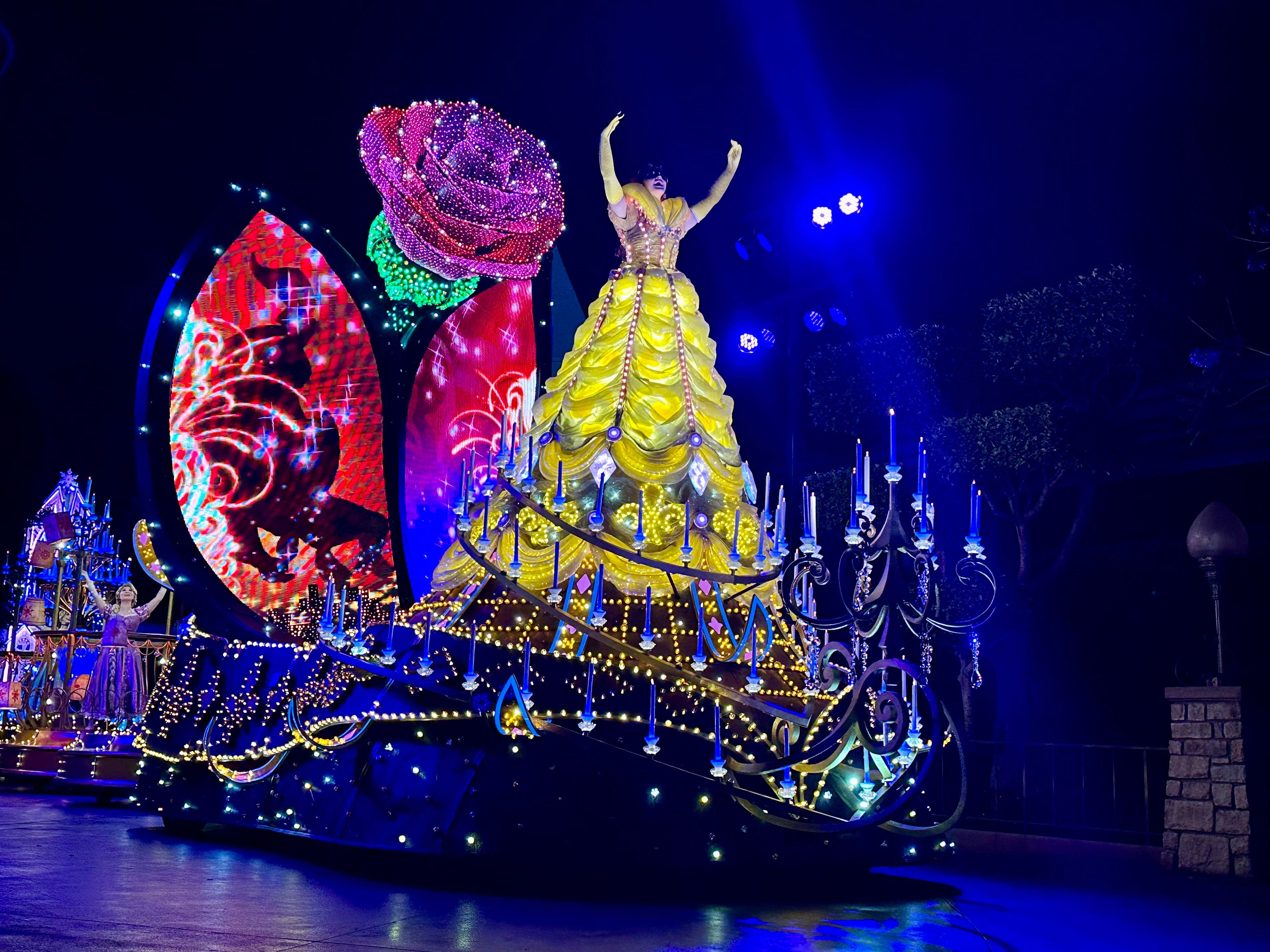 A parade at night at Disneyland.