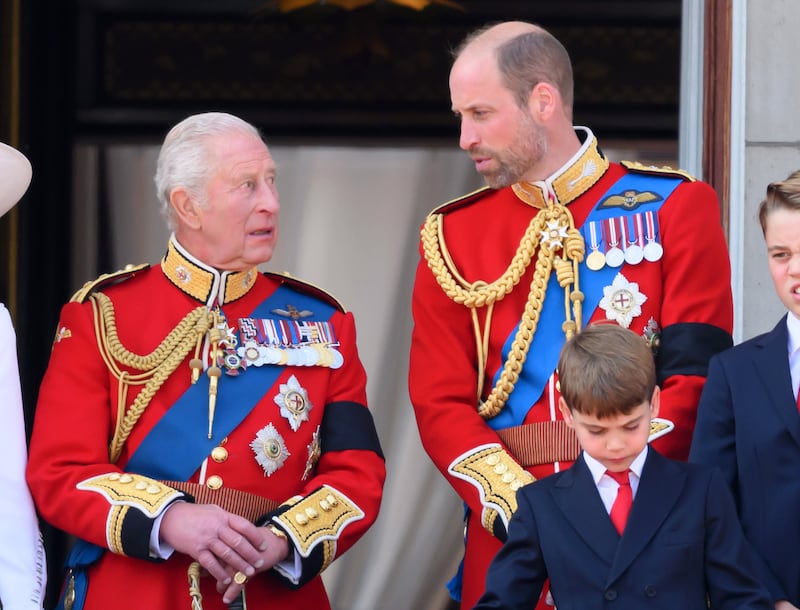 LONDON, ENGLAND - JUNE 14: King Charles III and Prince William, Prince of Wales on the balcony at Buckingham Palace during Trooping The Colour 2025 on June 14, 2025 in London, England. Trooping The Colour is a ceremonial parade celebrating the official birthday of the British Monarch. The event features over 1,400 soldiers and officers, accompanied by 200 horses. More than 400 musicians from ten different bands and Corps of Drums march and while performing. (Photo by Karwai Tang/WireImage)