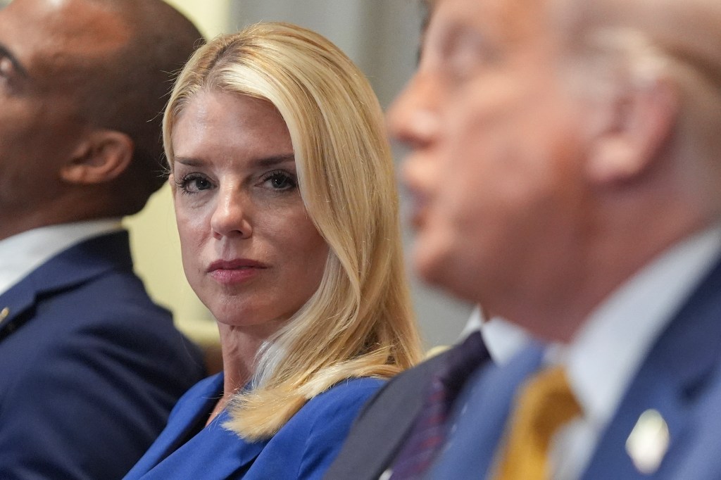 Pam Bondi and Donald Trump at a cabinet meeting.