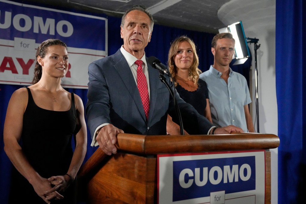 Andrew Cuomo speaks at a mayoral campaign event with his family.
