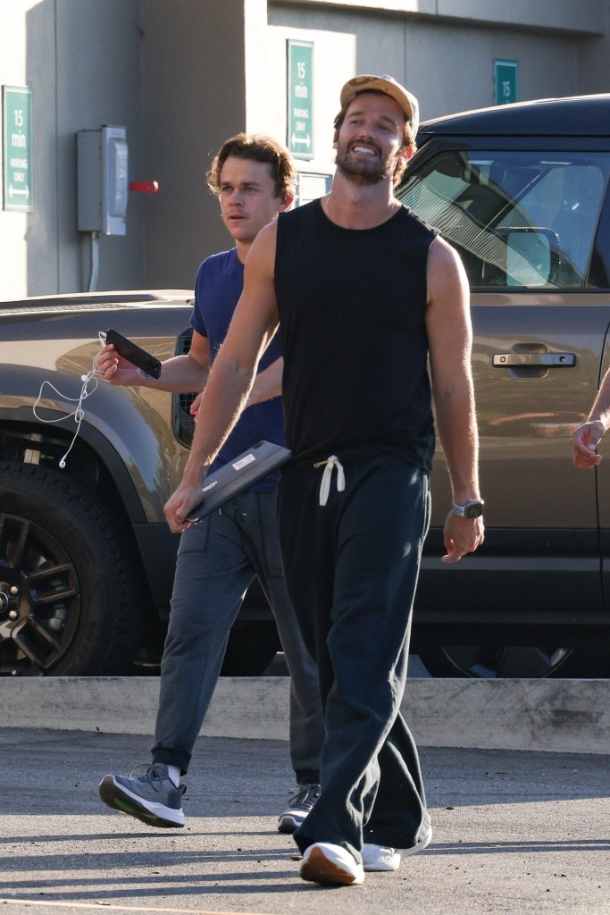 Patrick Schwarzenegger flaunted his toned arms while with John Owen Lowe in Los Angeles on Saturday.
