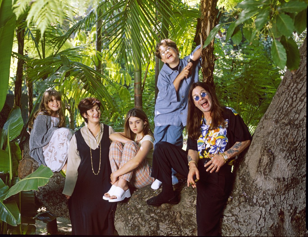 Ozzy Osbourne and Sharon Osbourne pose with their grandkids.