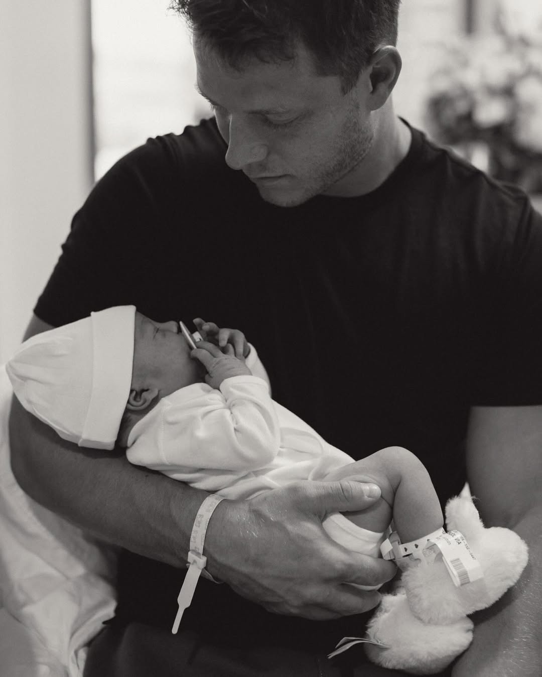 Christian McCaffrey holding his daughter
