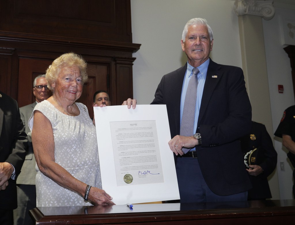 Nassau County Executive Bruce Blakeman signs an executive order supporting law enforcement.