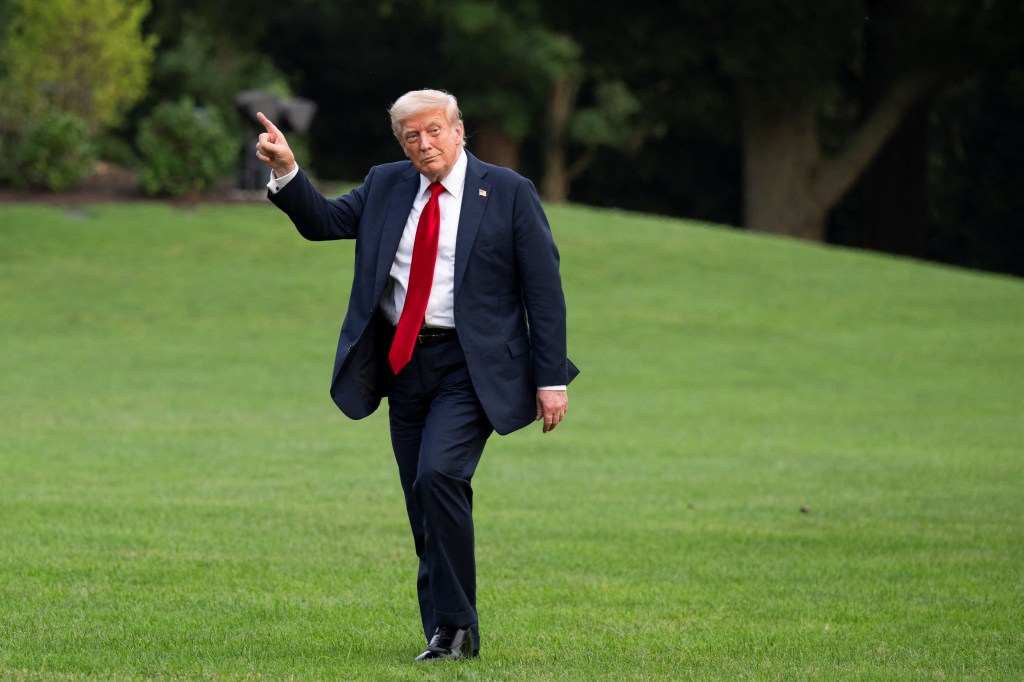 President Trump arriving at the White House, pointing.