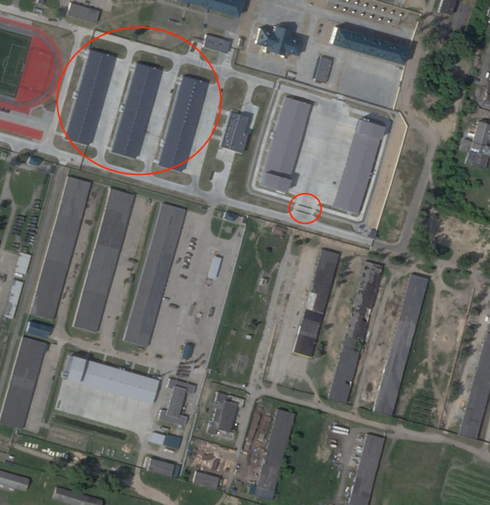 Annotations on a satellite image over the city of Asipovichy show likely garages and support buildings for the Iskander missile launcher base.