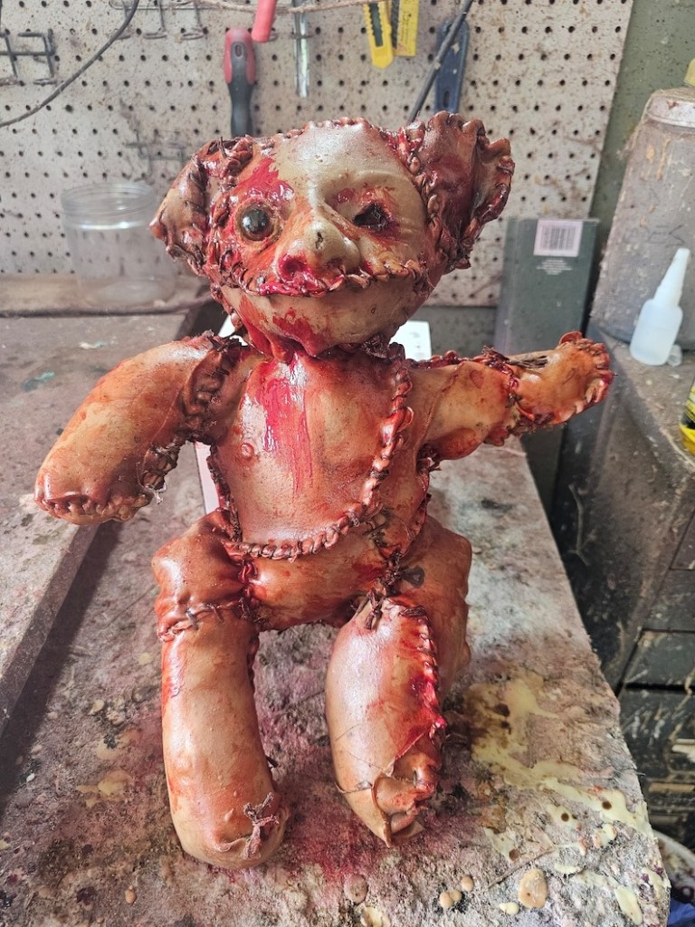teddy bear that appeared to be wrapped in human skin was left on a sidewalk
