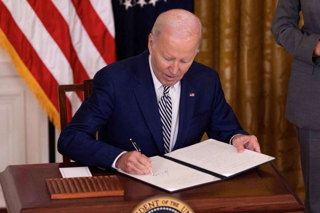 U.S. President Joe Biden signs an executive order at the White House in Washington, D.C. Oct. 30, 2023.