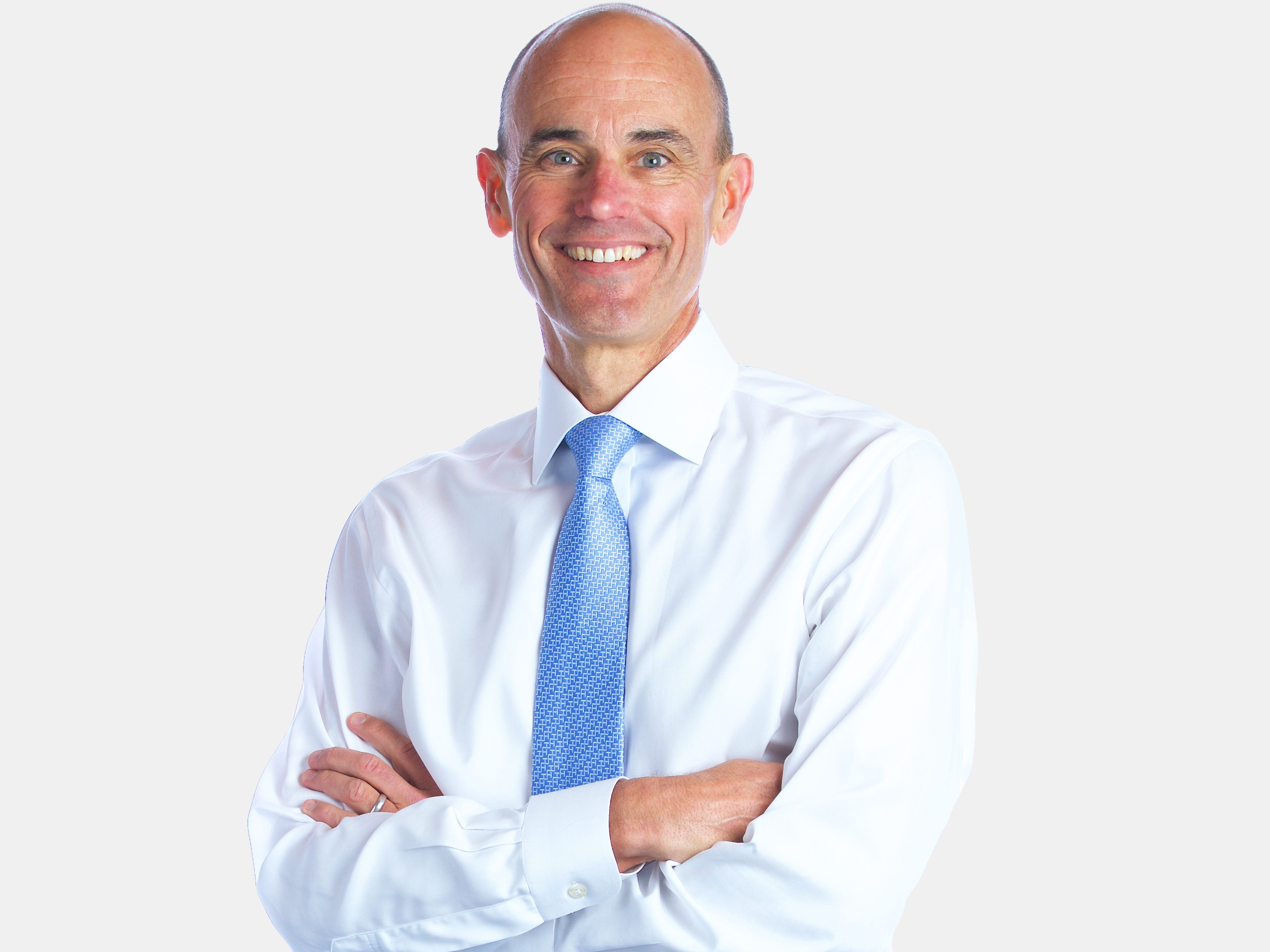 Bob Sternfels in white shirt and blue tie