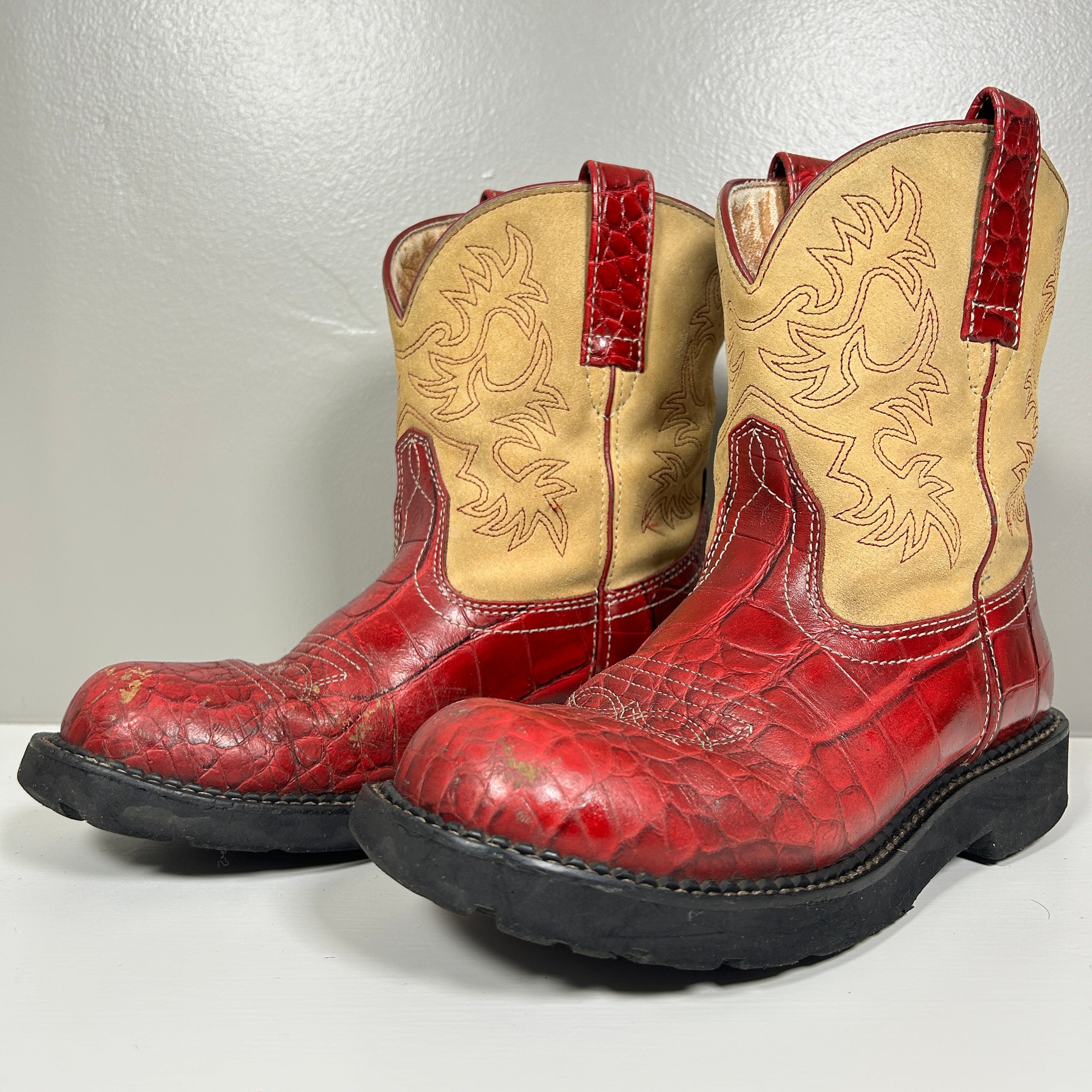 pair of used red cowboy boots