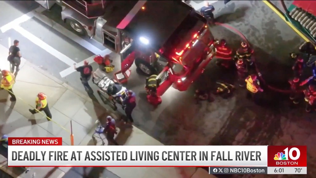 Aerial view of emergency responders at a deadly fire in an assisted living facility.
