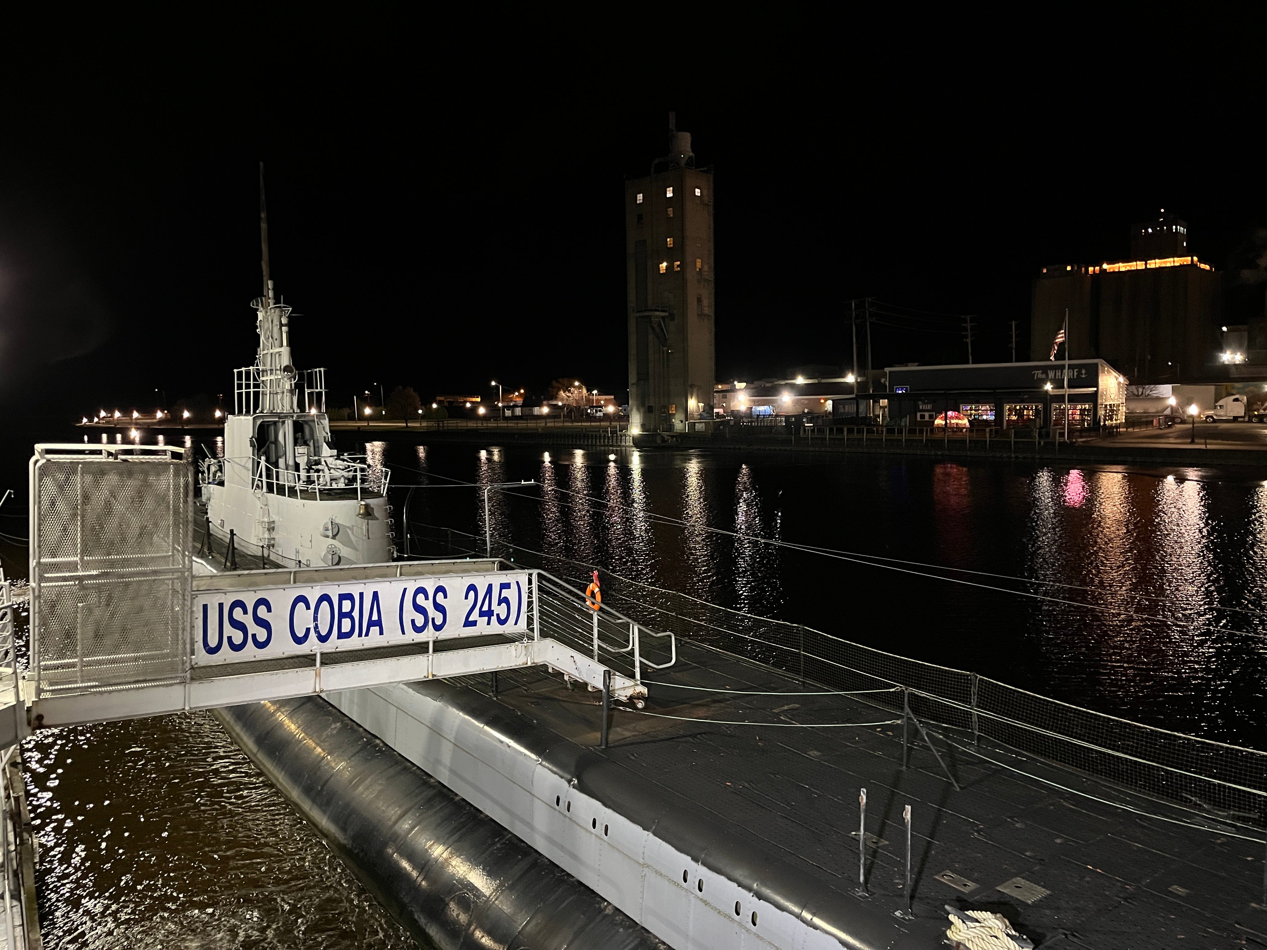The USS Cobia at night.
