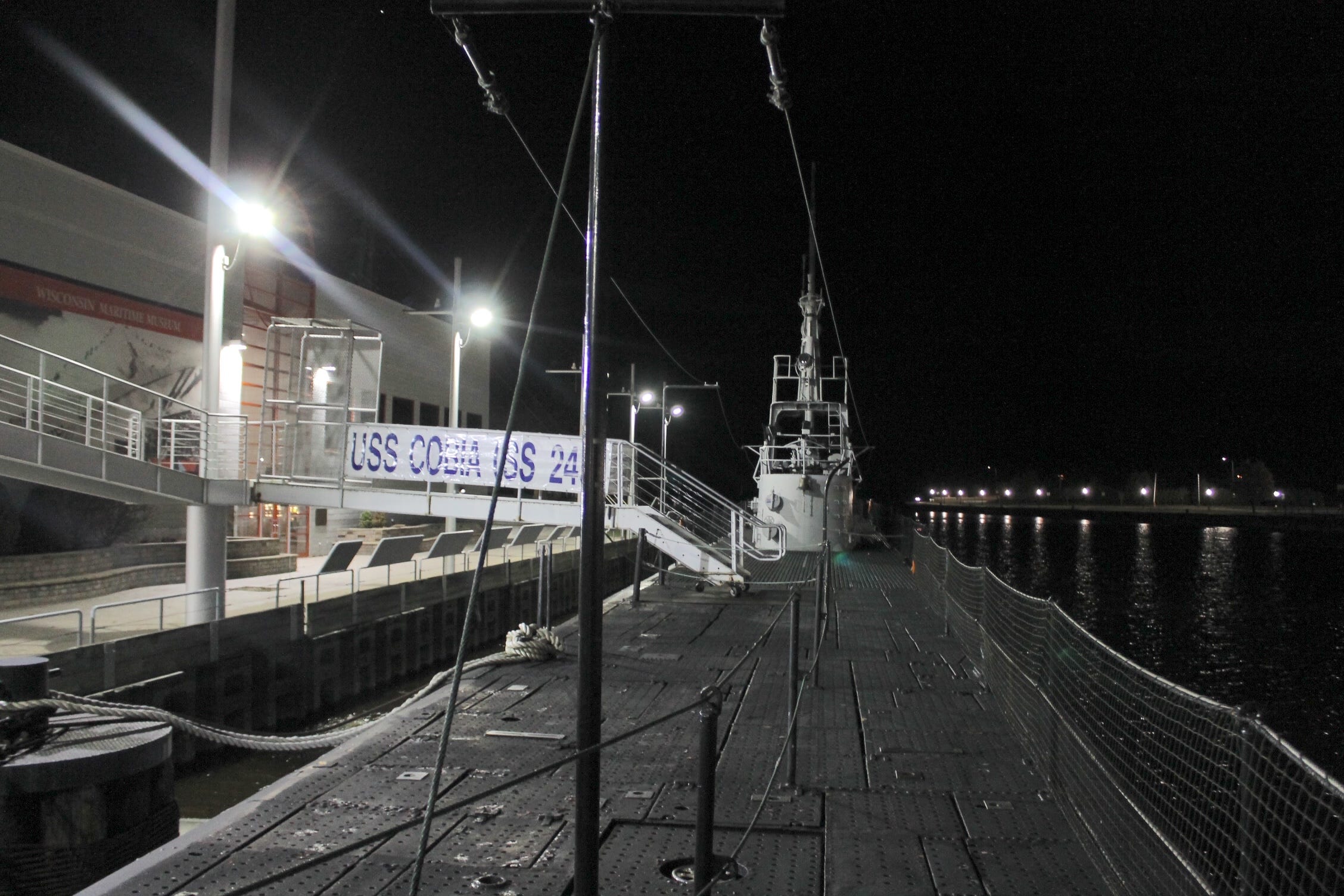 The deck of the USS Cobia at night.