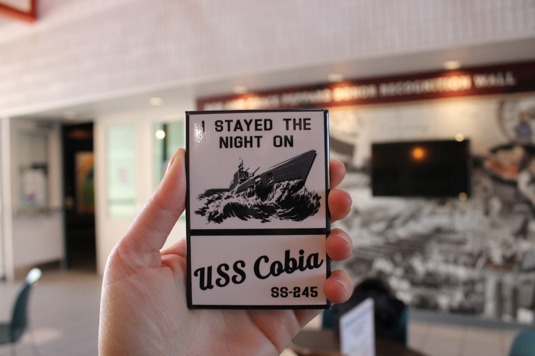 A magnet that reads "I stayed the night on USS Cobia."