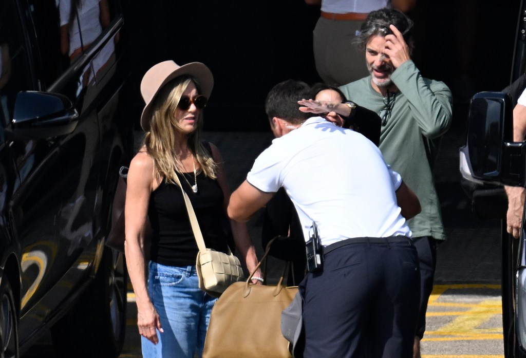 Jennifer Aniston and Jim Curtis in Spain Saturday