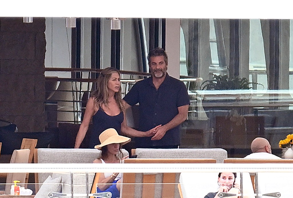Jennifer Aniston and Jim Curtis in Spain Saturday