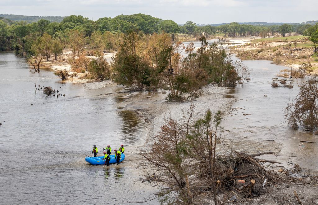 Search team in a raft on the Guadalupe River in Kerrville, Texas, after flooding.