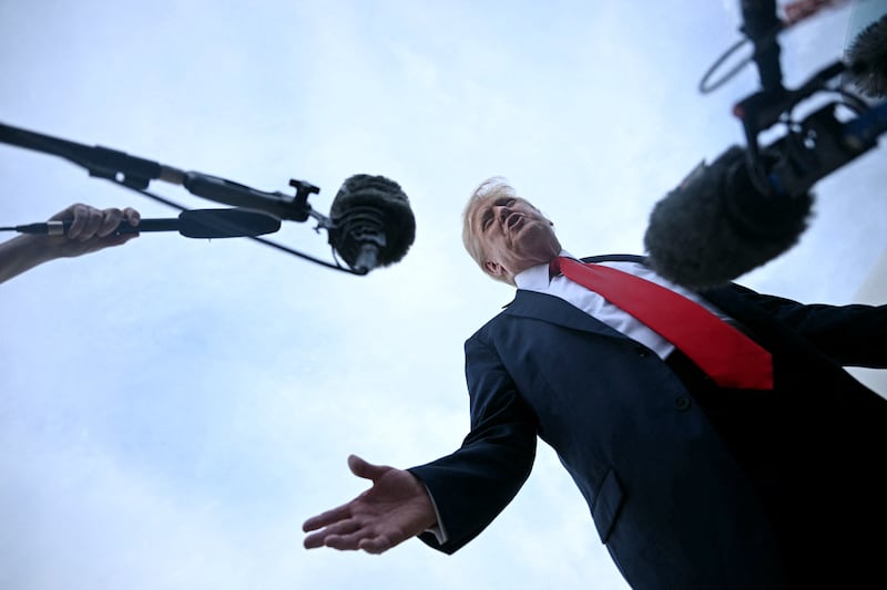 President Donald Trump speaks with the press upon arrival at Joint Base Andrews in Maryland on July 13, 2025 after attending the 2025 FIFA Club World Cup final in East Rutherford, New Jersey.