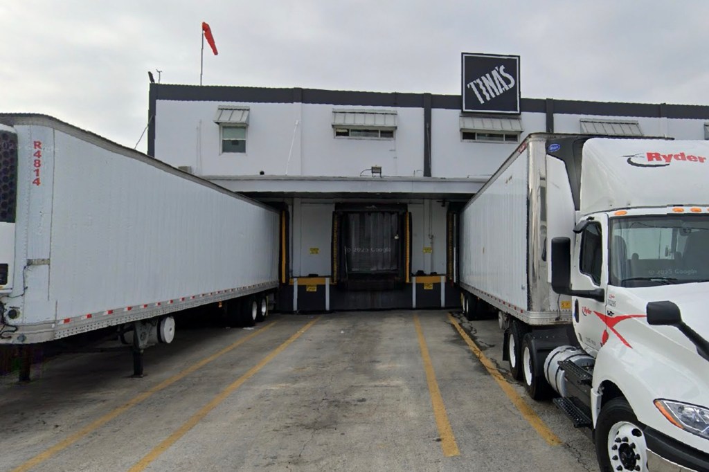 Tina's Burrito Factory loading dock with semi-trucks.