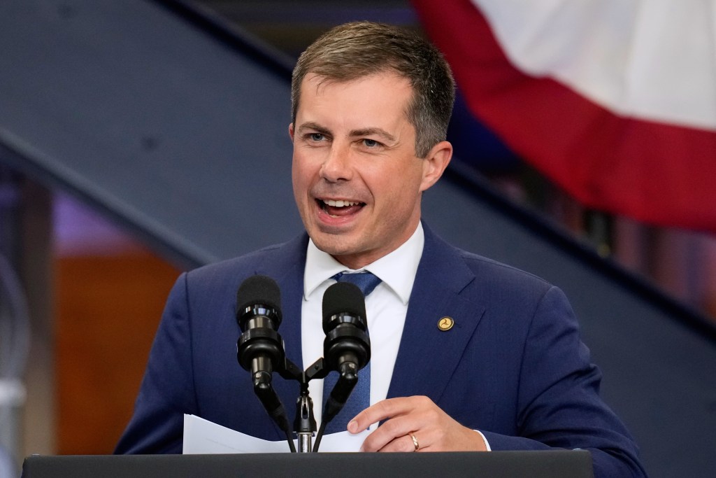 Pete Buttigieg speaking at a podium.