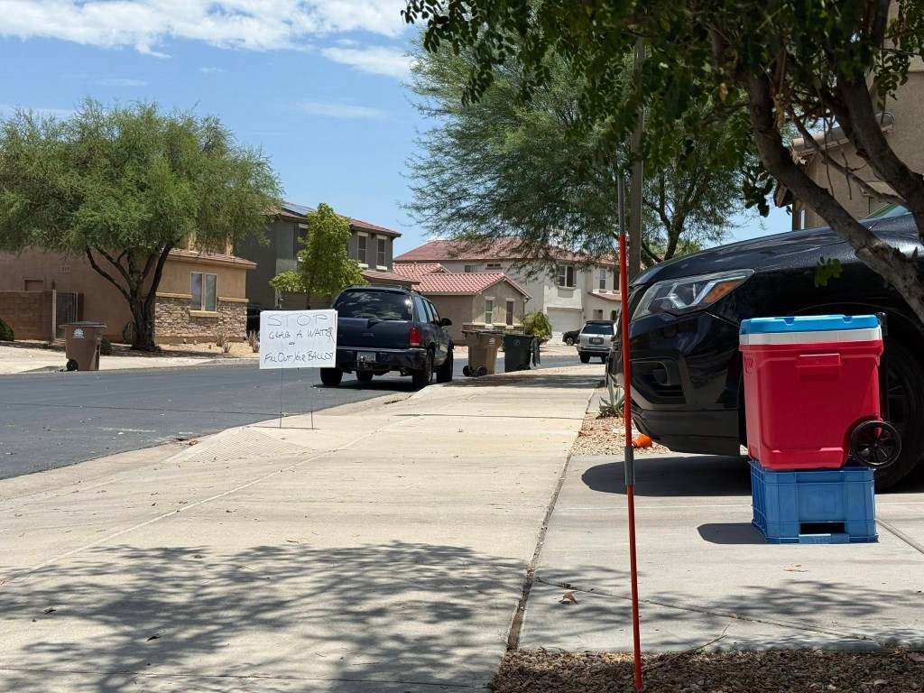 A sign campaigning against certain HOA members Martin said are behind the citations.