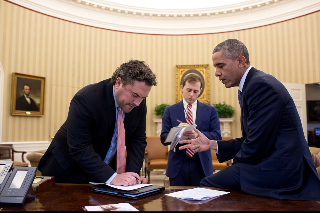 President Obama with speechwriters in the Oval Office.