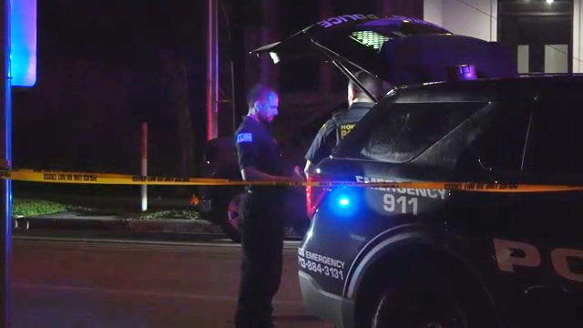 Police officers at a crime scene.