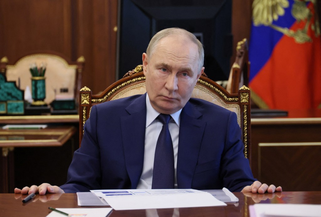 Vladimir Putin chairing a meeting on social issues in Moscow.