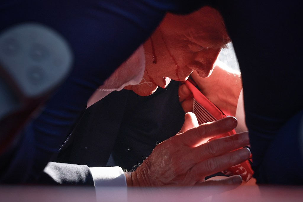 Photo of Donald Trump injured at a campaign rally.