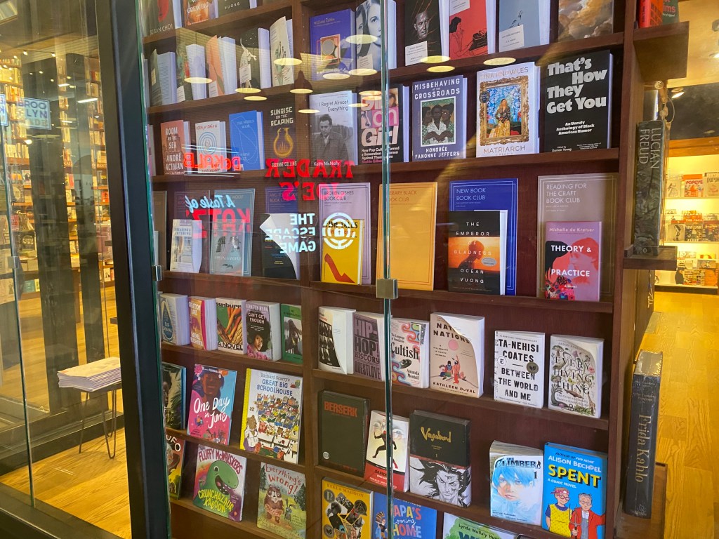 Bookstore shelves filled with various books.