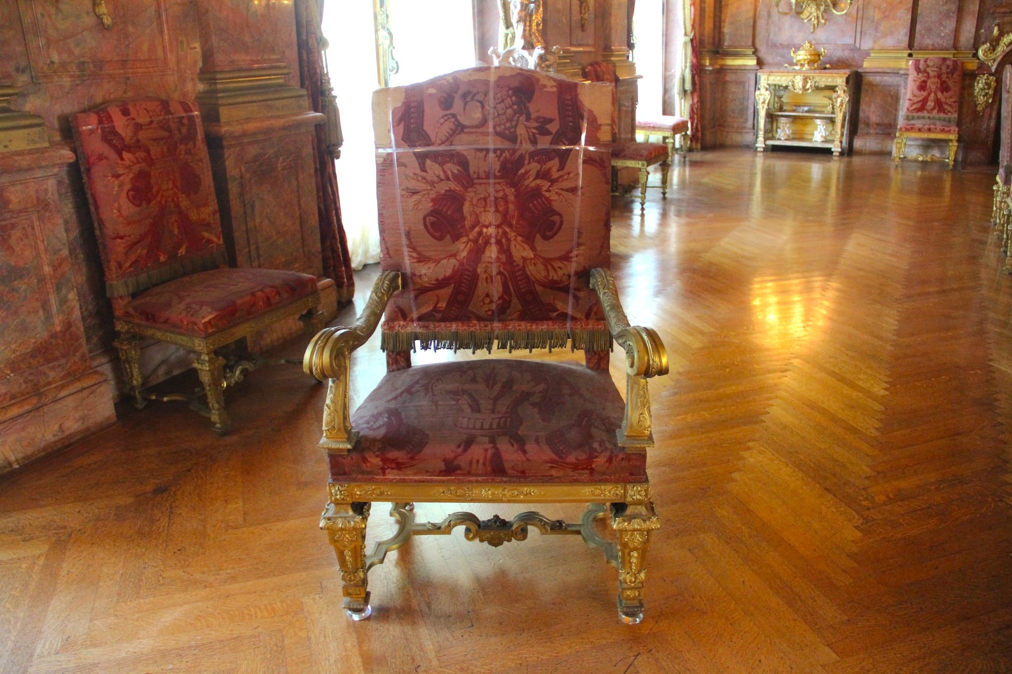A purple gilded dining room chair at Marble House.