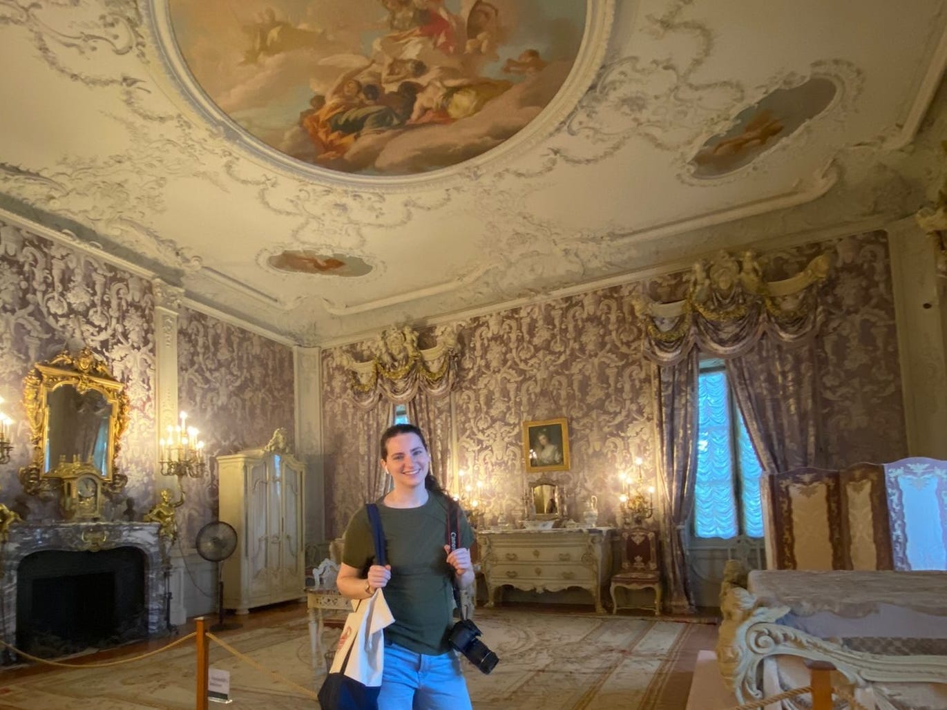 Talia Lakritz holds a camera and poses at Marble House in Newport, Rhode Island.