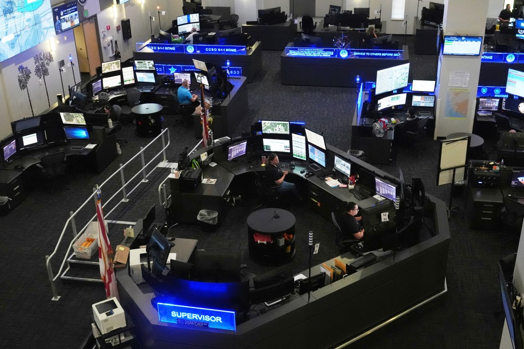US emergency dispatch center with dispatchers at work.