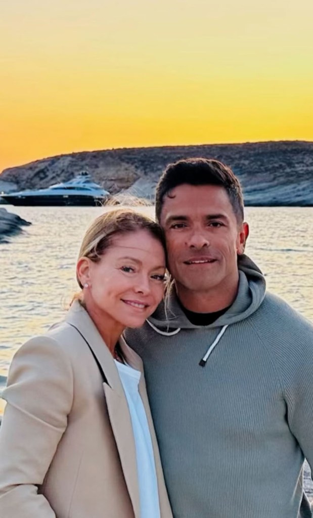 Kelly Ripa and Mark Consuelos on the beach. 