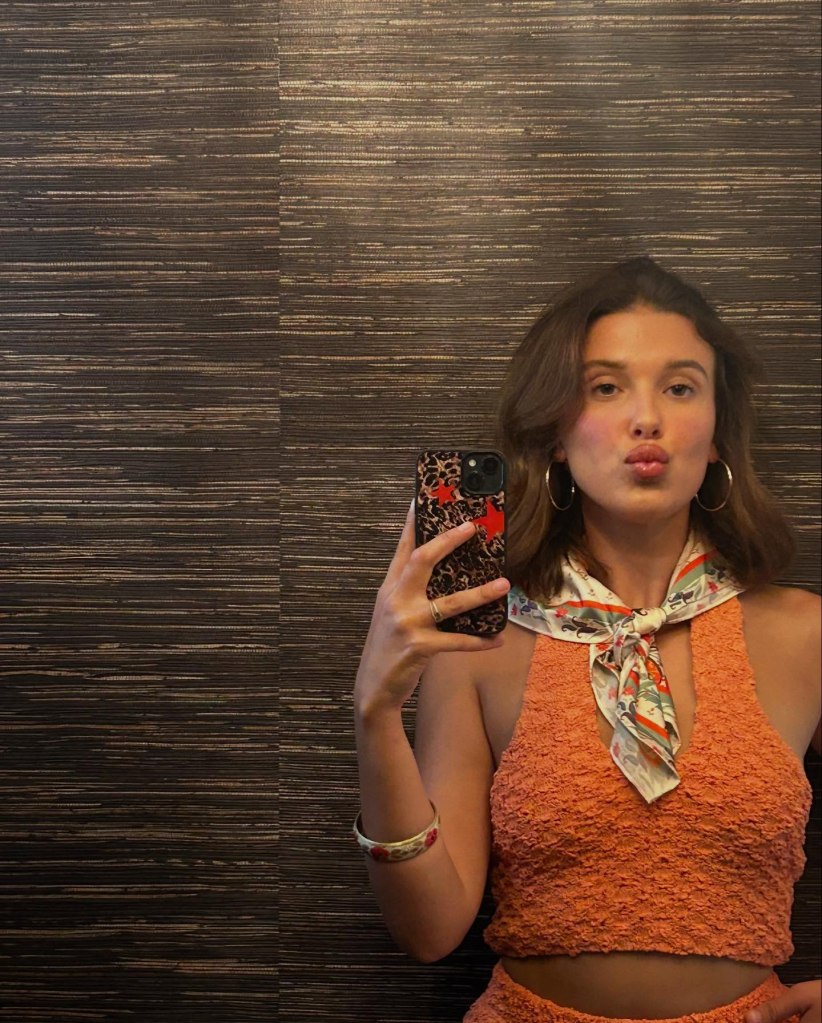 Millie Bobby Brown puckers up in a mirror selfie.