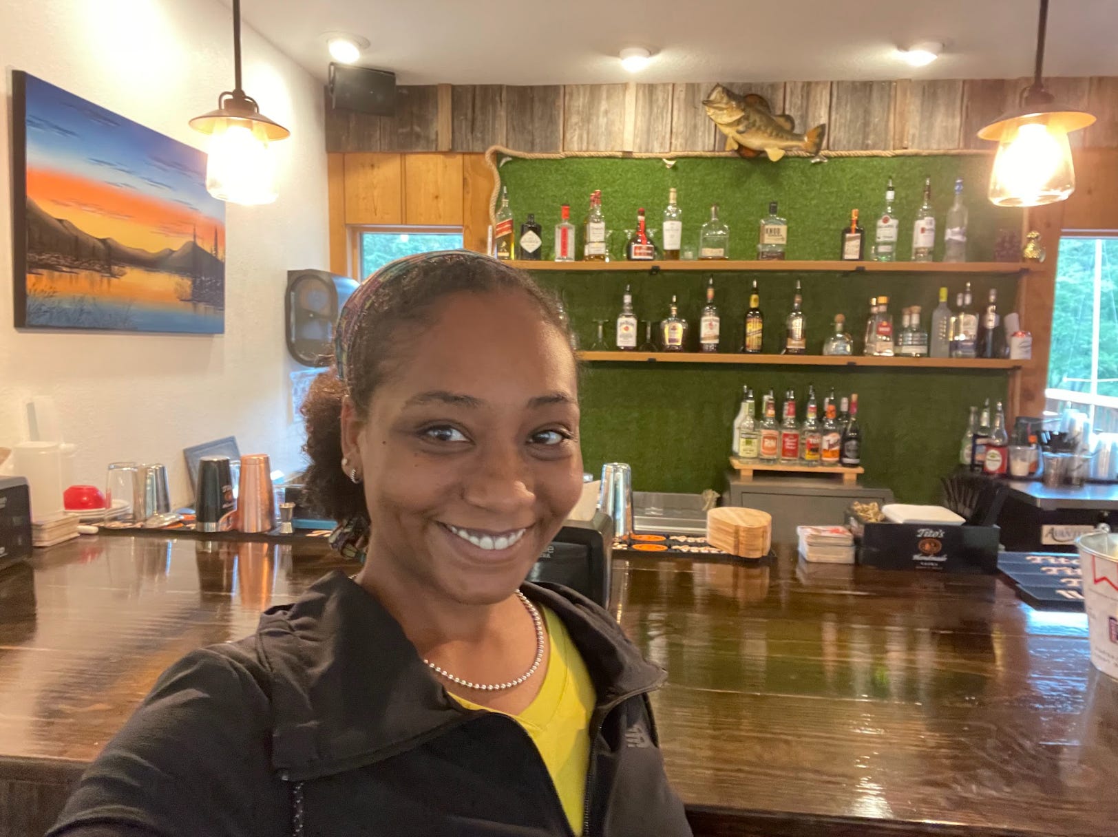 The writer at the bar of her restaurant.
