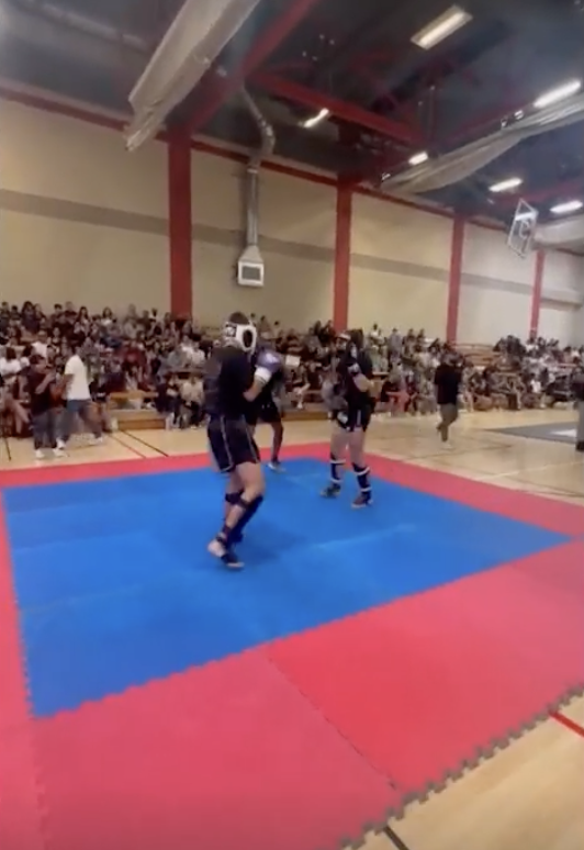 Knox Jolie Pitt fighting in an MMA competition.