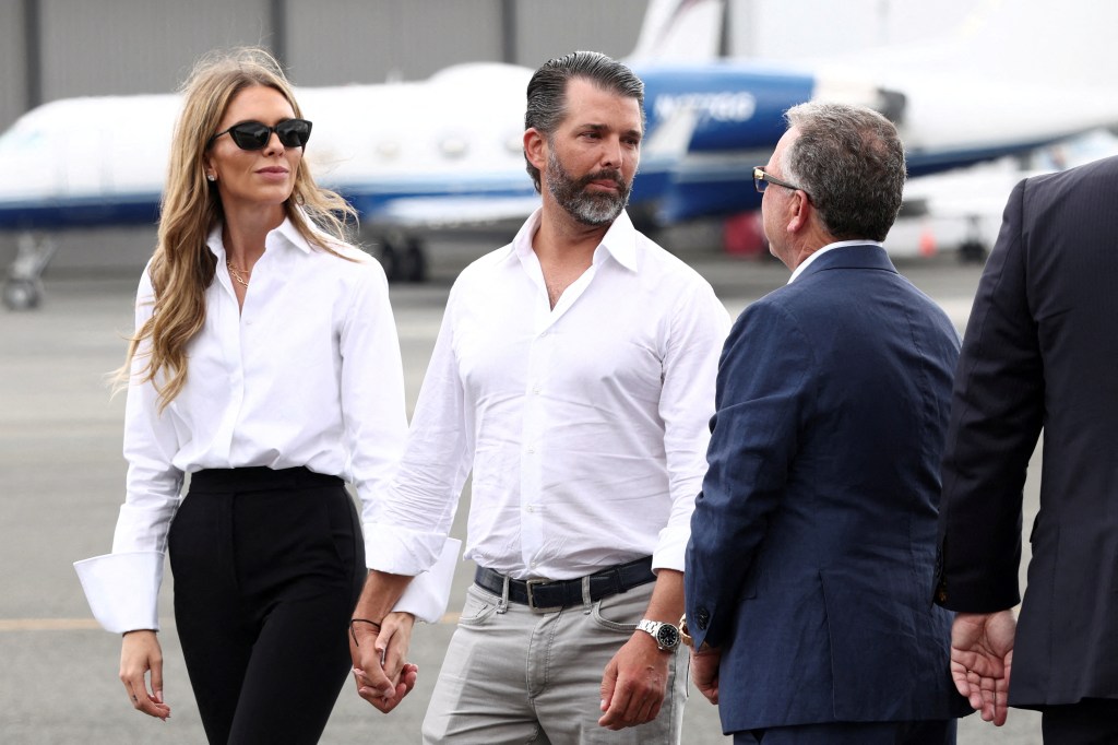 Donald Trump Jr. and Bettina Anderso nwait for the arrival of U.S. President Donald Trump at Teterboro Airport in New Jersey on July 13.