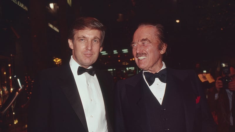 Donald Trump and his father, Fred Trump, attend a book release party in New York, 1987.