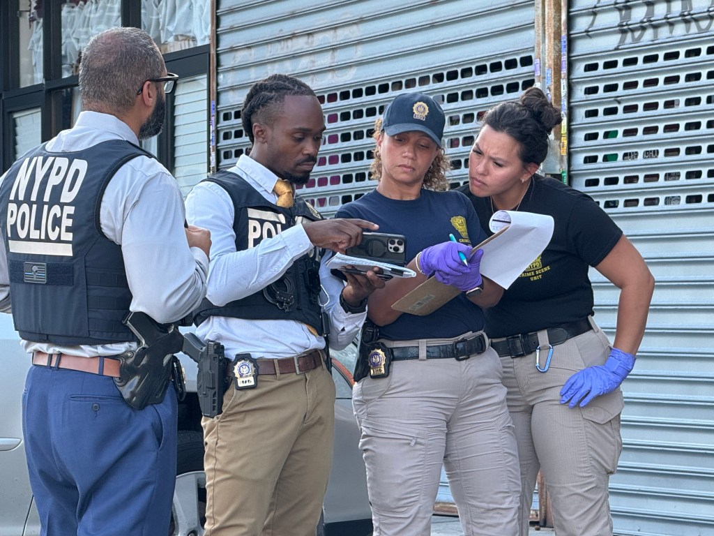 NYPD officers investigating a homicide.