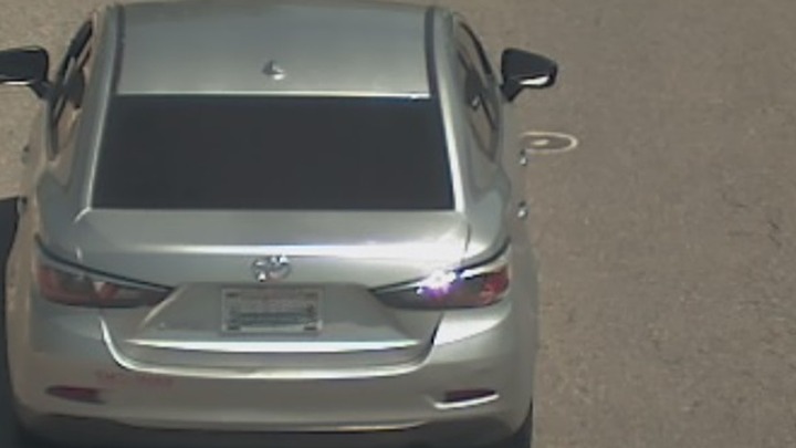 Rear view of a silver Toyota Yaris.
