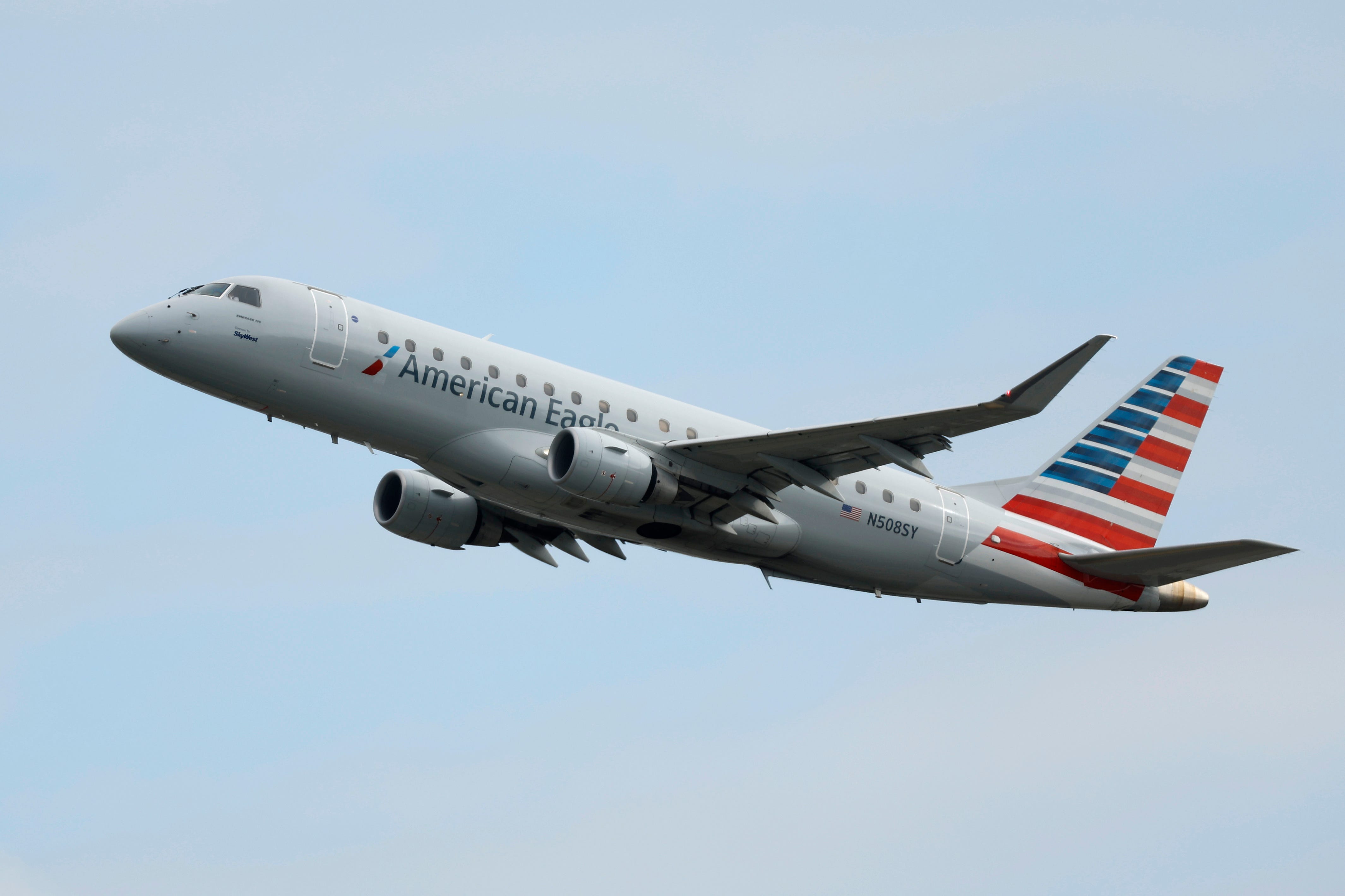 An American Eagle, operated by SkyWest Airlines, Embraer E175LR airplane departs Los Angeles International Airport en route to Denver on March 30, 2025 i