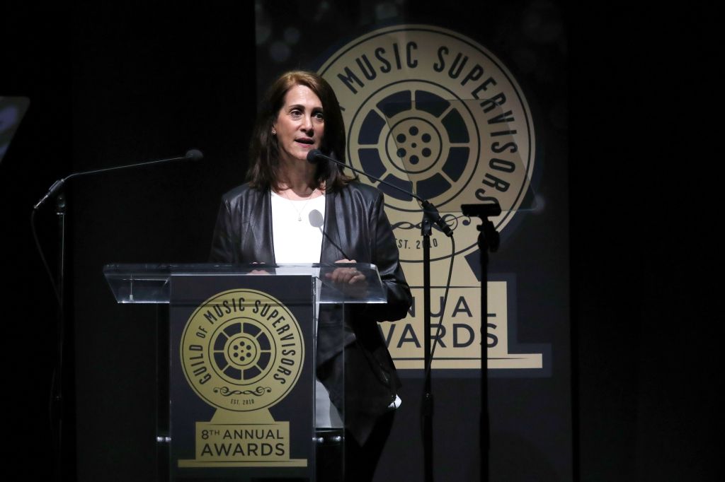 Woman speaking at the 8th Annual Guild of Music Supervisor Awards.