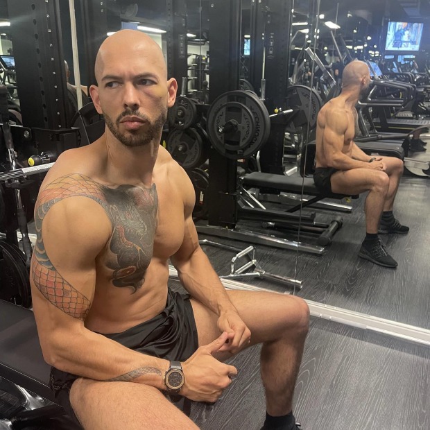 Andrew Tate sitting in a gym.