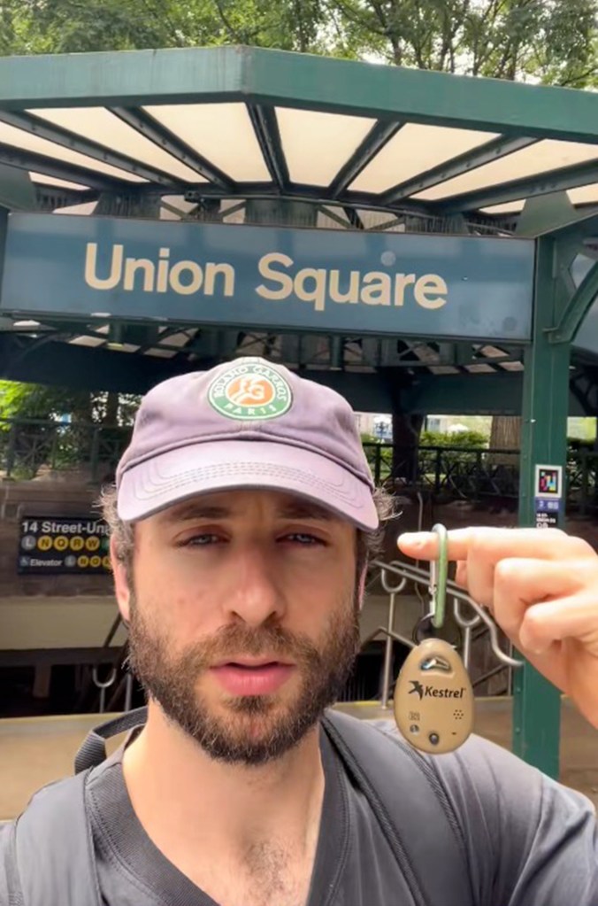 Man at Union Square subway station holding a Kestrel device.